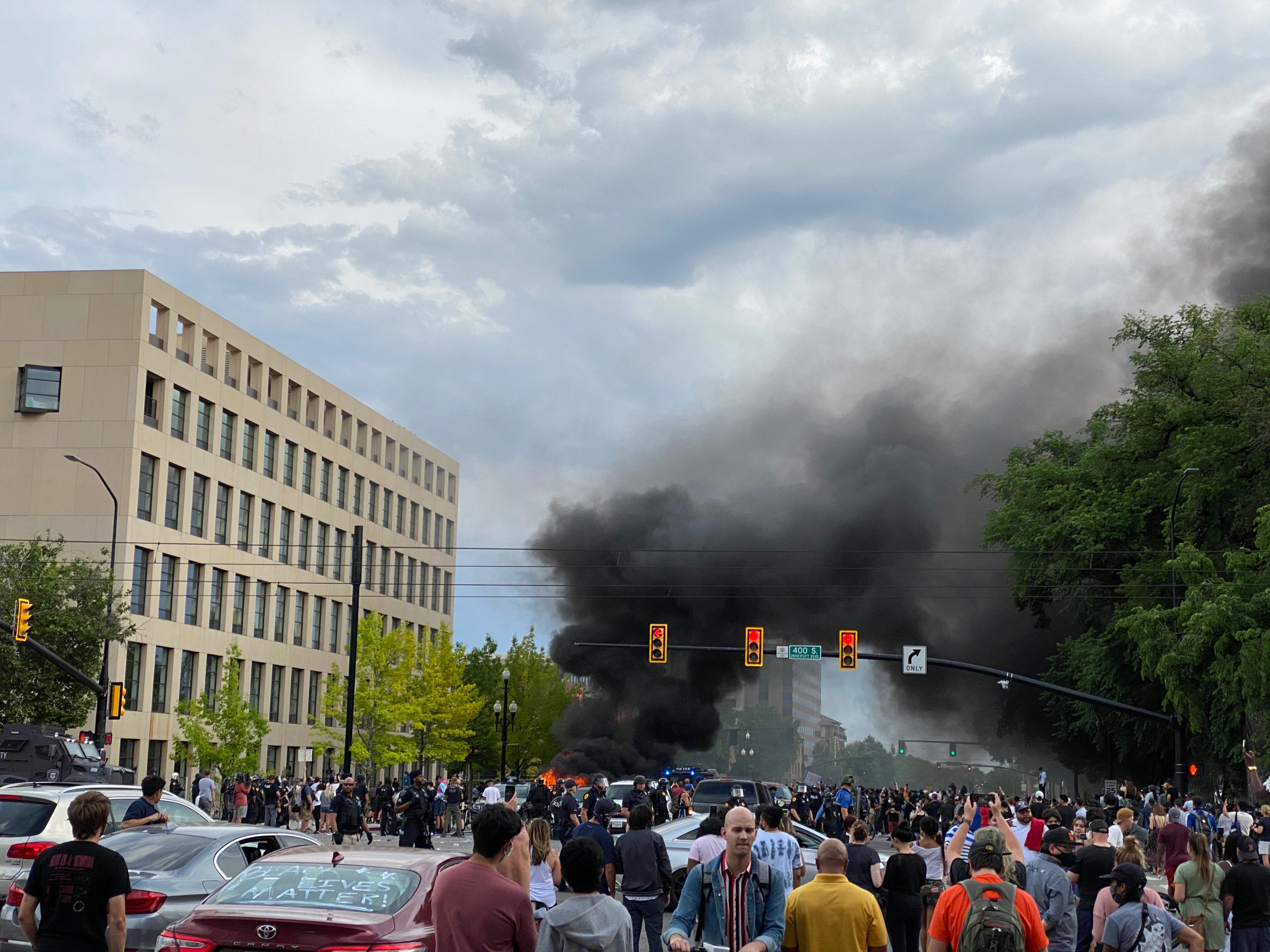 The second car set aflame, belonging to a man who shot a hunting arrow into the crowd.